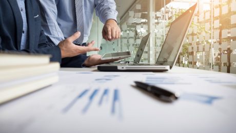 Business adviser analyzing financial figures denoting the progre