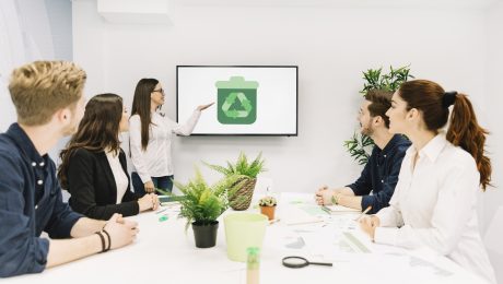 Business partners looking at female manager