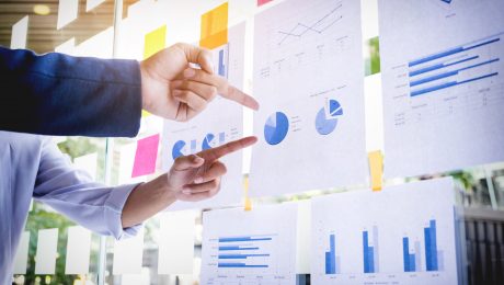 Businessman making presentation with his colleagues and business