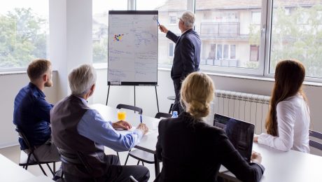 Senior businessman giving presentation